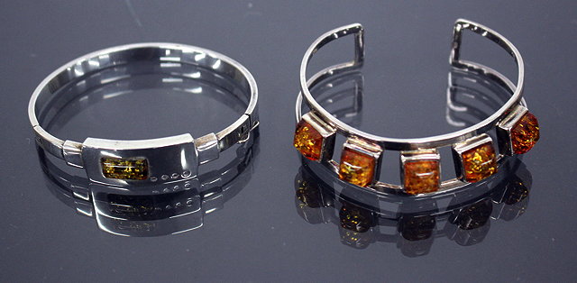 Appraisal: A SILVER BRACELET set with five pieces of amber together