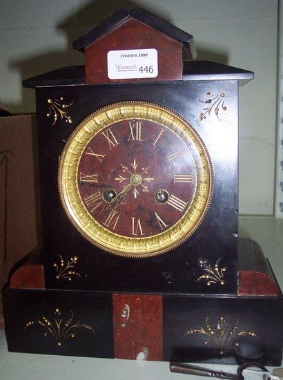 Appraisal: A black slate cased mantel clock of architectural form the