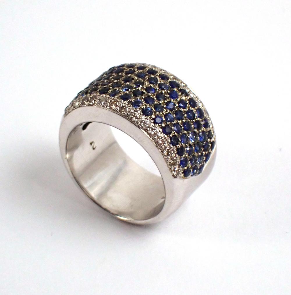 Appraisal: SAPPHIRE DIAMOND AND FOURTEEN KARAT GOLD RING The wide k