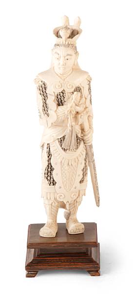 Appraisal: A Chinese tinted ivory figure of a standing warrior on