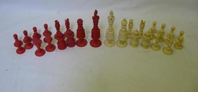 Appraisal: A BONE BARLEYCORN PATTERN CHESS SET one side red stained