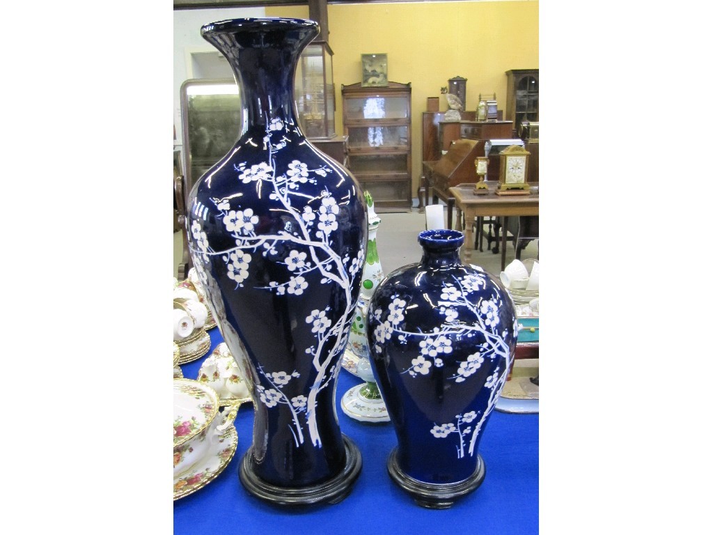 Appraisal: Two oriental large blue glazed vases with white blossom decoration