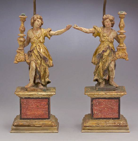 Appraisal: A pair of Italian carved polychrome and giltwood angels th