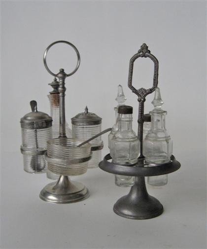 Appraisal: Pewter castor frame with bottles th century Having four paneled