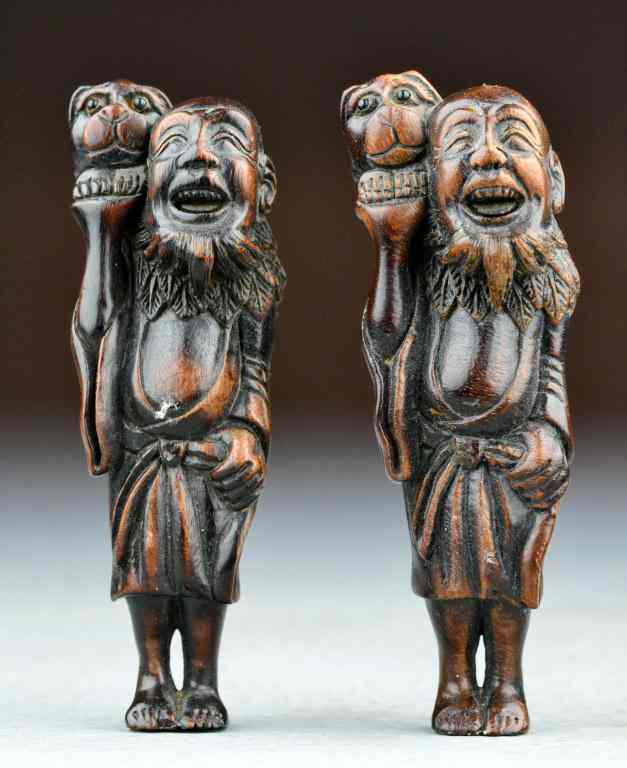 Appraisal: Japanese Meji Period Carved Rosewood NetsukeTo include two examples finely