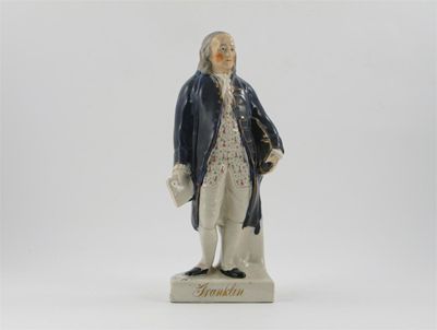 Appraisal: A Staffordshire model of Benjamin Franklin standing and holding his