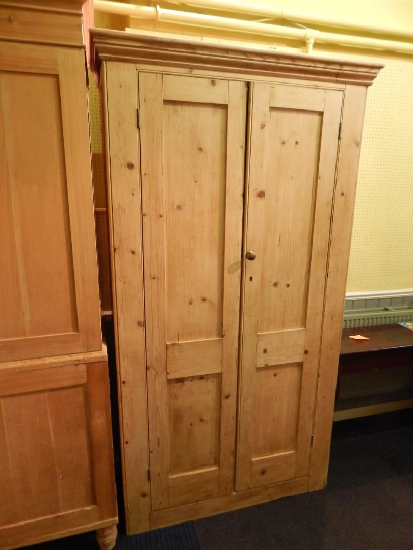 Appraisal: A thC pine cupboard with two panelled doors cm wide