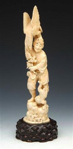 Appraisal: A PAIR OF JAPANESE CARVED IVORY FIGURES one a man