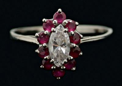 Appraisal: Diamond and ruby ring center marquis-cut diamond estimated weight cts