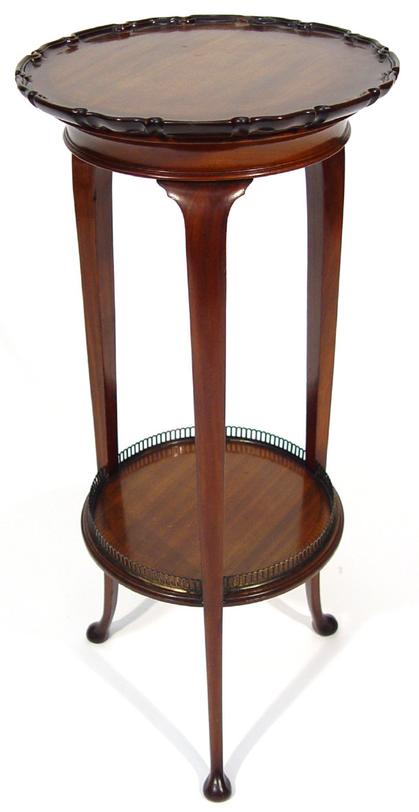 Appraisal: Mahogany plantstand with piecrust edge above a brass galleried undertier