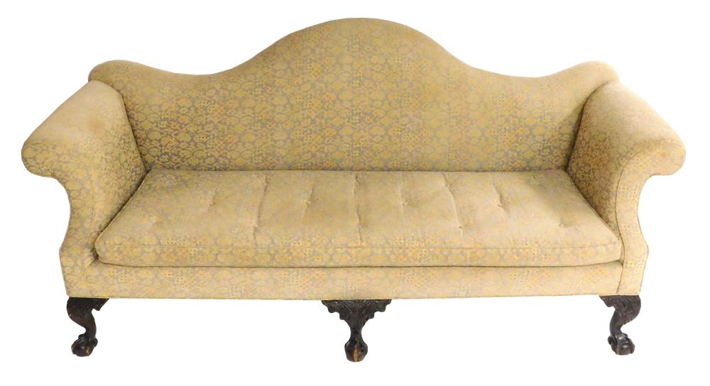 Appraisal: Chippendale form camel back sofa American upholstered serpentine back and