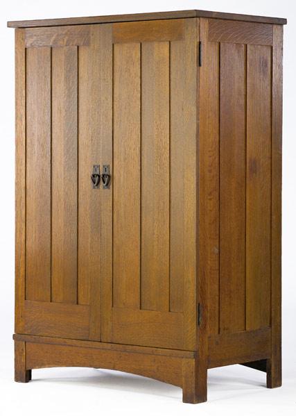 Appraisal: GUSTAV STICKLEY Wardrobe with paneled doors and sides full interior