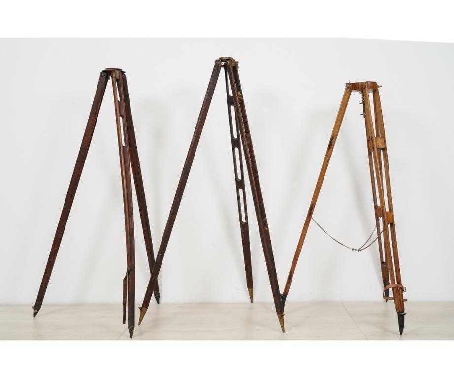 Appraisal: Three wood transit tripods one stamped B L on leg