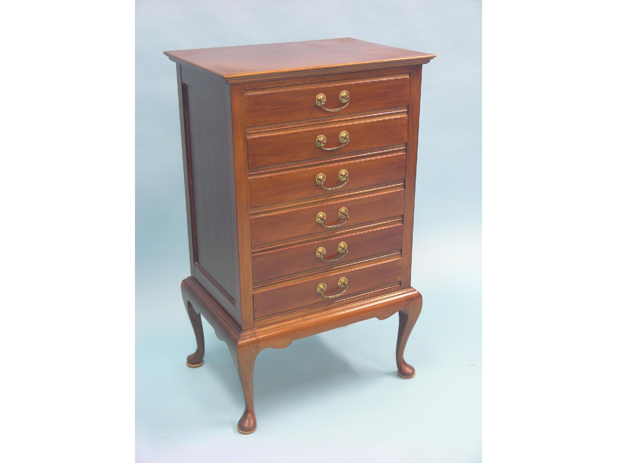 Appraisal: An early th century mahogany music chest six fall-front drawers