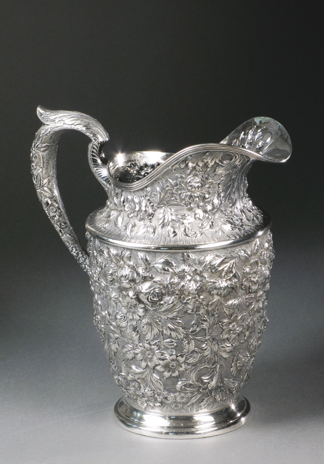 Appraisal: AMERICAN STERLING SILVER PITCHER in a floral repousse pattern Marked