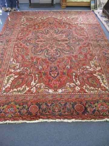 Appraisal: Heriz Persian Handmade Romm Size Rug grand central medallion elaborate