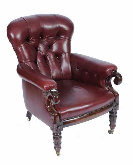 Appraisal: A VICTORIAN LIBRARY ARMCHAIR by Holland Sons upholstered in studded