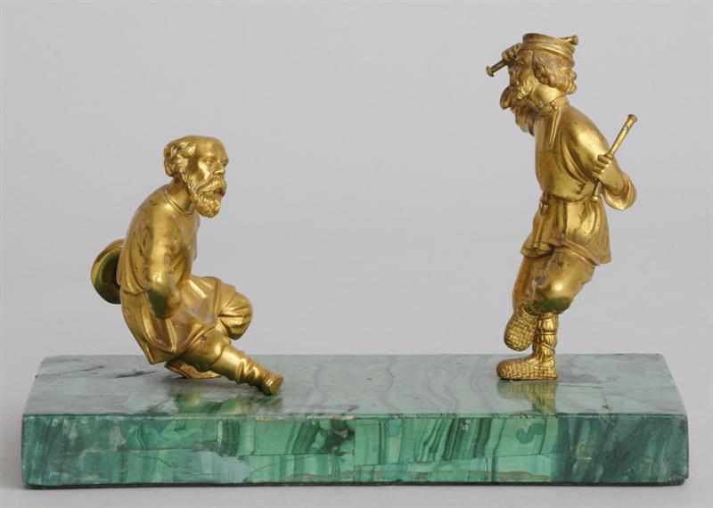 Appraisal: RUSSIAN GILT-BRONZE GROUP ON MALACHITE BASE Modeled as two serfs