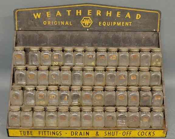 Appraisal: Weatherhead Original Equipment glass jars with metal display rack h