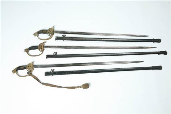 Appraisal: THREE SWORDS Germany early th century Similar hinged guards two