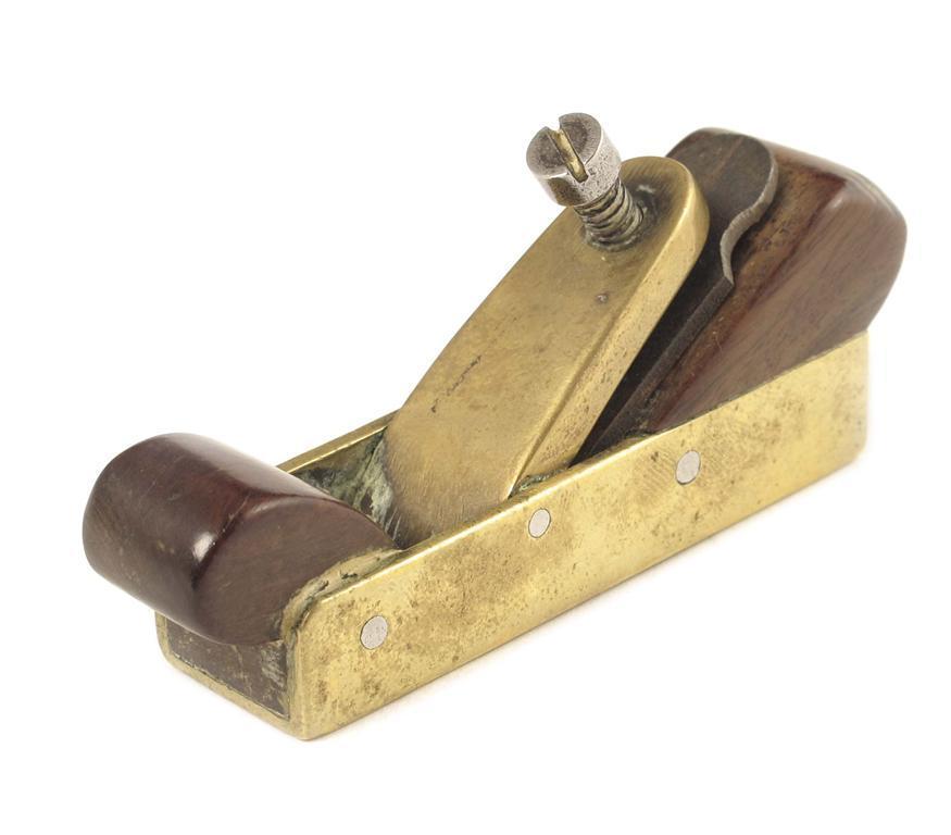 Appraisal: A miniature brass and fruitwood plane