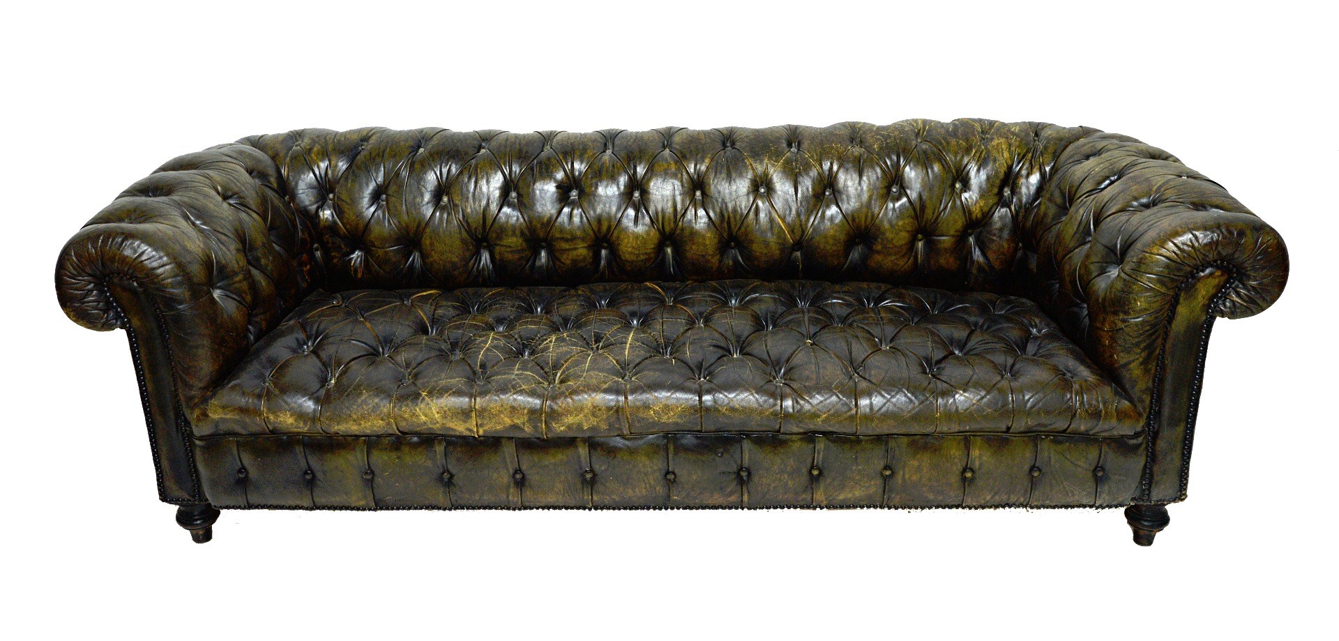 Appraisal: A green leather button upholstered Chesterfield sofa with studded decoration