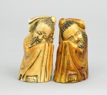 Appraisal: A Pair of Signed Carved Ivory Figurines of Sleeping Gods