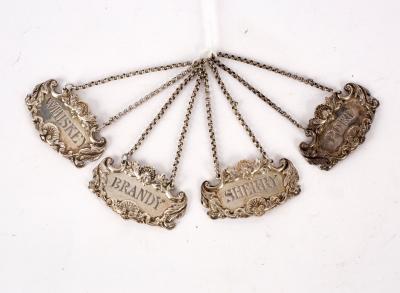 Appraisal: A set of four silver spirit labels Richard Martin Ebenezer