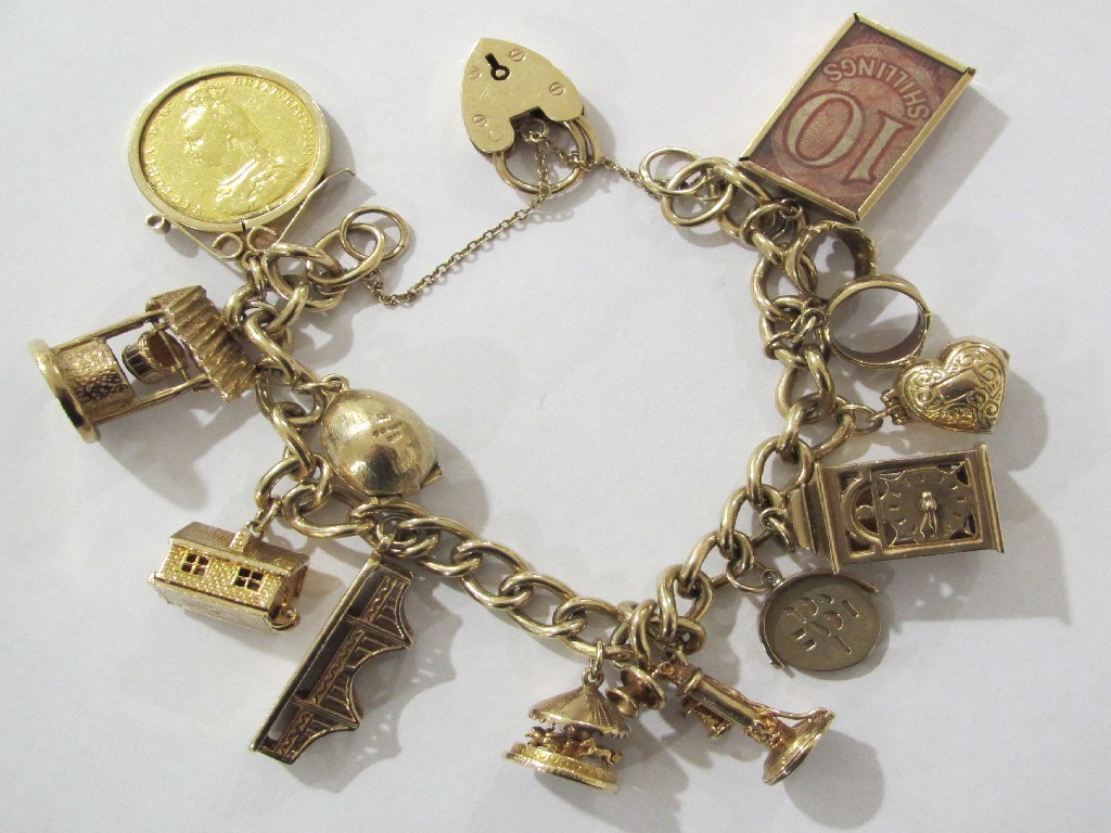 Appraisal: Nine carat gold charm bracelet with eleven various mid sized