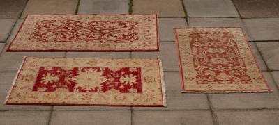 Appraisal: Three modern Pakistani rugs the largest cm x cm