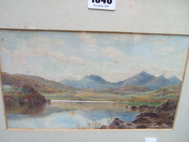 Appraisal: A group of four including a watercolour lake scene signed