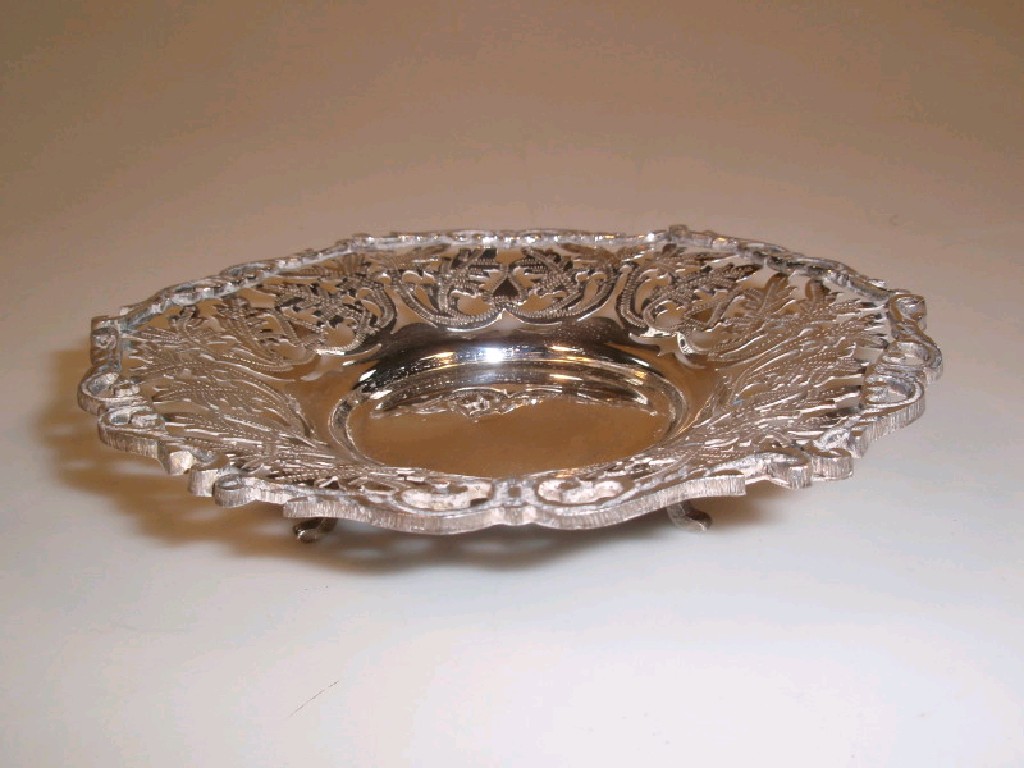 Appraisal: An Egyptian silver bon-bon dish with a foliate pierced border