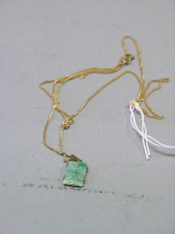 Appraisal: A ct gold chain with carved jade pendant