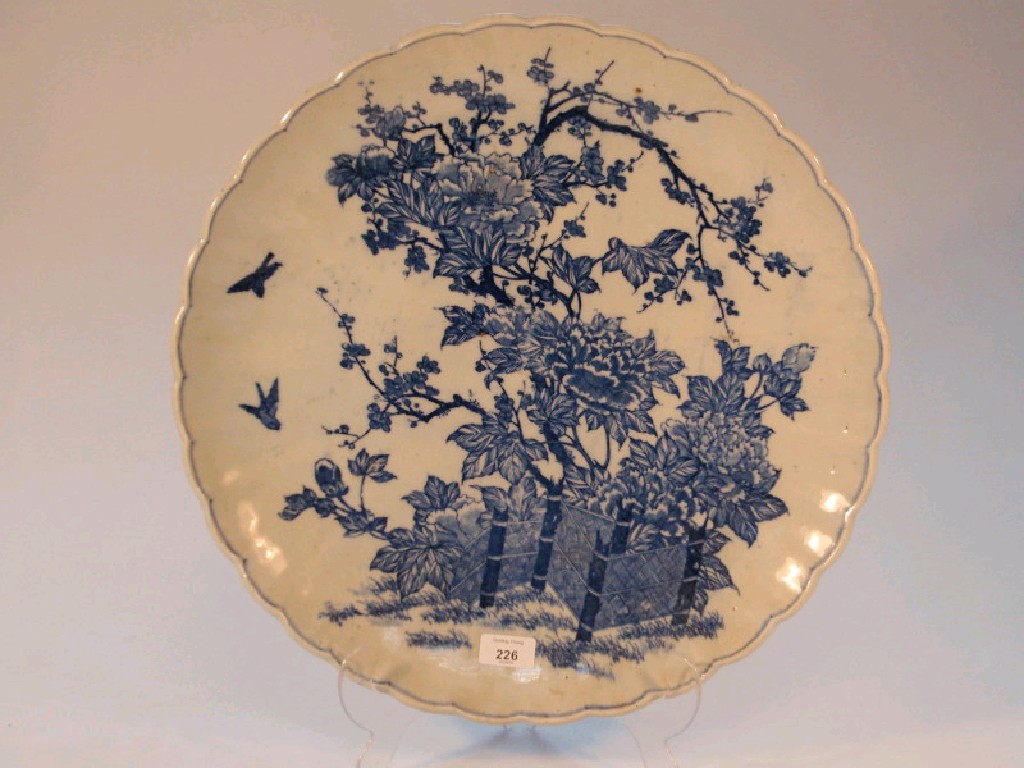 Appraisal: A large Chinese blue and white charger decorated with flowering