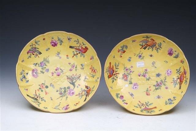 Appraisal: A PAIR OF CONTINENTAL IMPERIAL YELLOW GROUND SAUCER DISHES painted