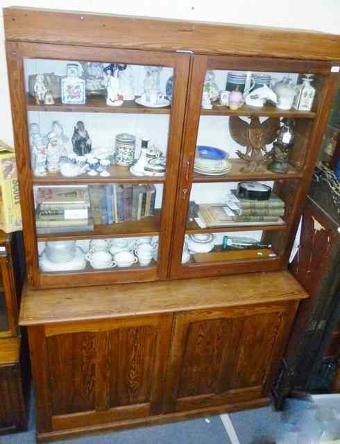 Appraisal: A VICTORIAN PITCH PINE DRESSER with glazed doors above enclosing