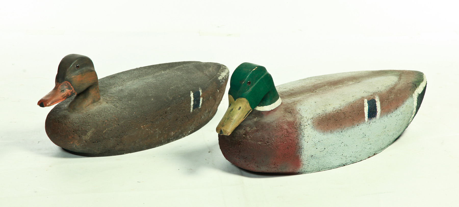 Appraisal: PAIR OF AMERICAN OVERSIZE DUCK DECOYS Ohio ca Cork with