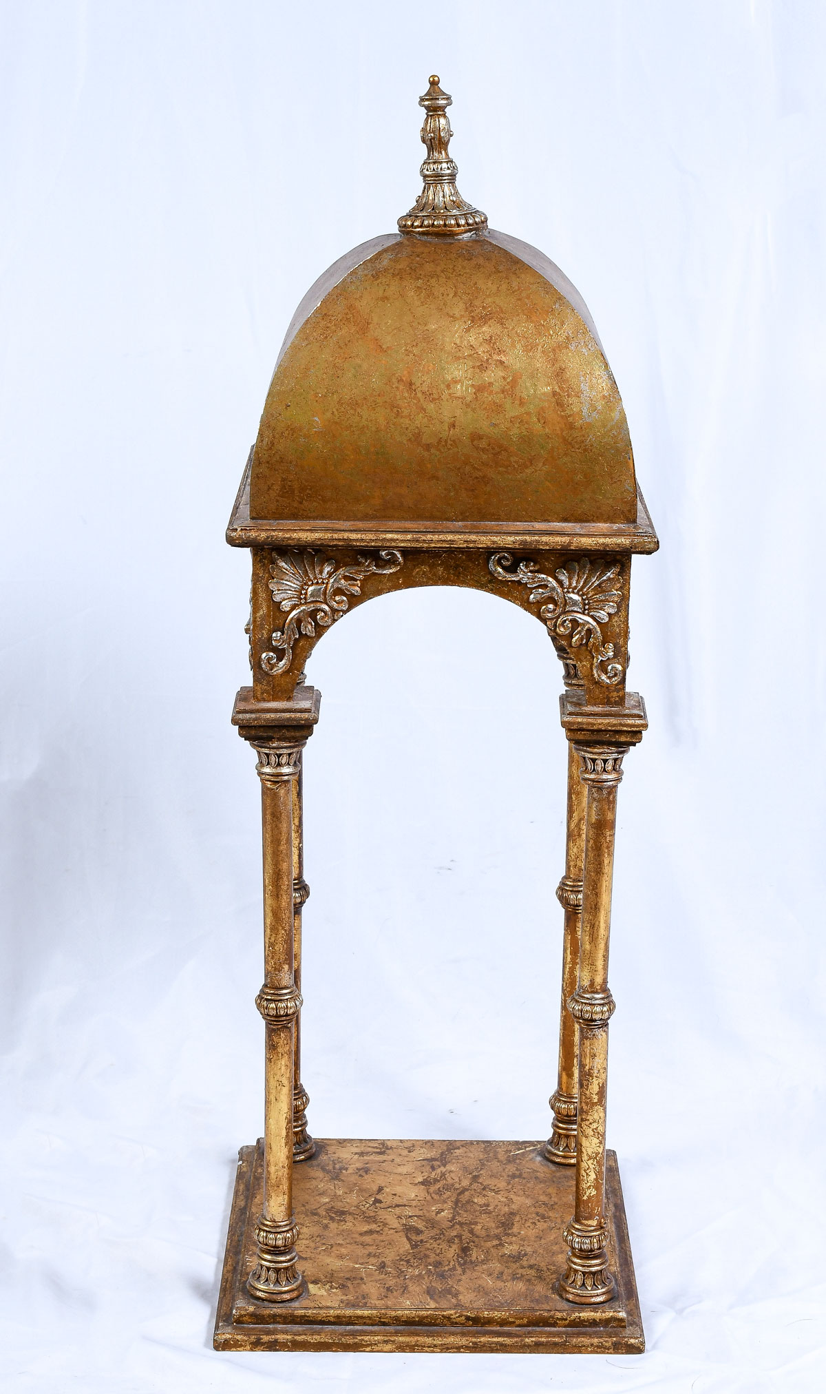 Appraisal: GILT ARCH FORM DISPLAY STAND Surmounting carved finial on a