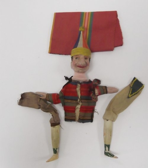 Appraisal: A carved wooden figure of a jester complete with arms