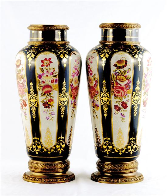 Appraisal: Pair Continental porcelain vases urn form with panels of flowers