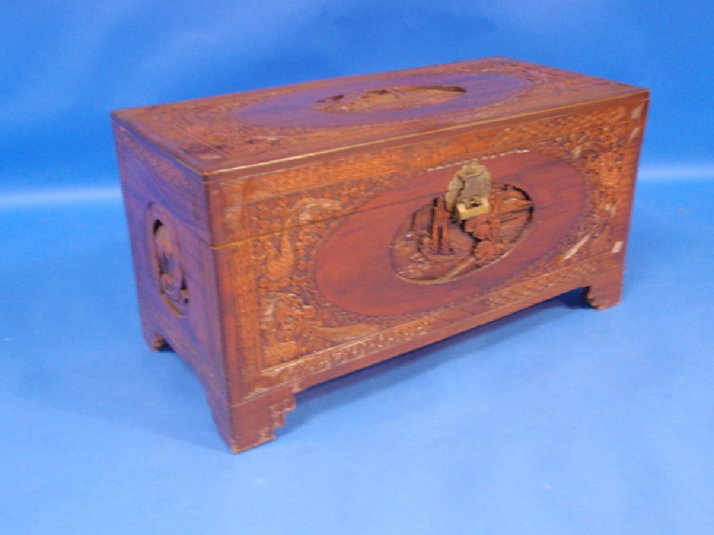 Appraisal: A carved camphor wood blanket box