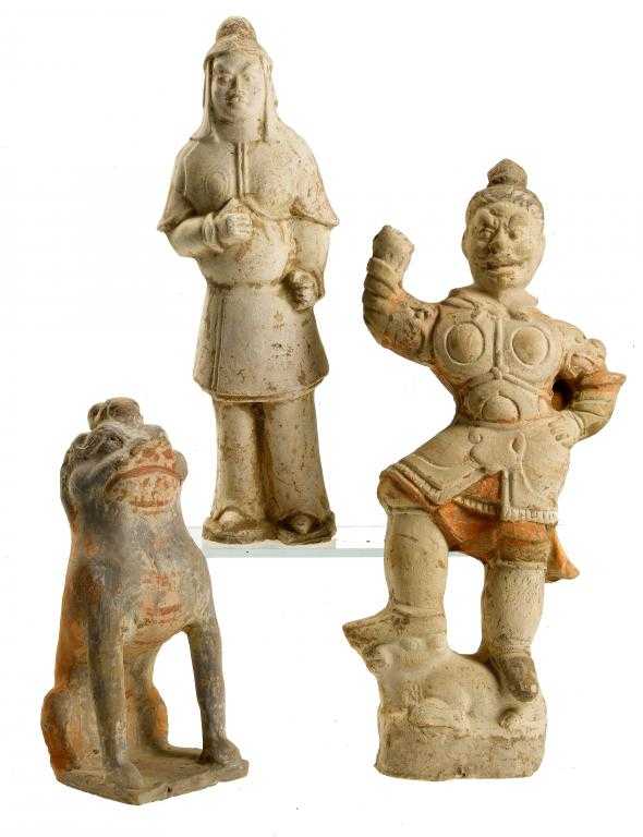 Appraisal: TWO EARTHENWARE FIGURES OF A TOMB GUARDIAN AND AN OFFICER