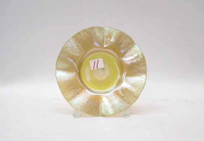 Appraisal: A TIFFANY FAVRILE IRIDESCENT ART GLASS PLATE with wide undulating