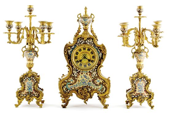 Appraisal: French champleve enamel clock garniture th century Rococo ormolu framed