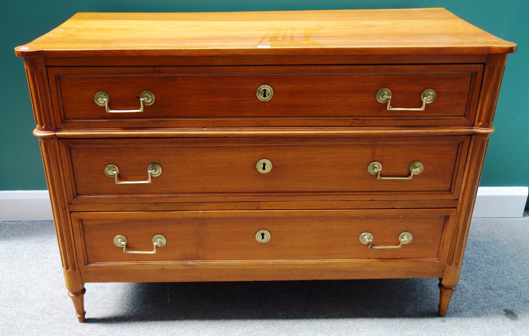 Appraisal: An early th century French walnut three drawer commode with