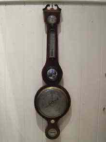 Appraisal: A Victorian wheel barometer the flame mahogany case with breakfront