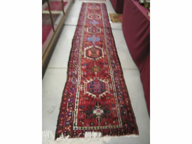 Appraisal: Heriz Persian Handmade Runner rich colors geometric medallions ' x