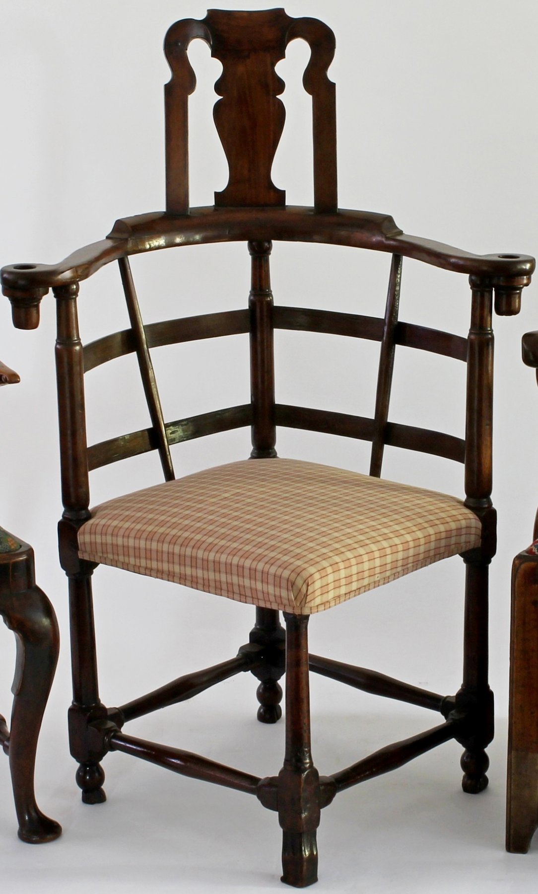 Appraisal: A George II walnut corner writing chair with vase shaped