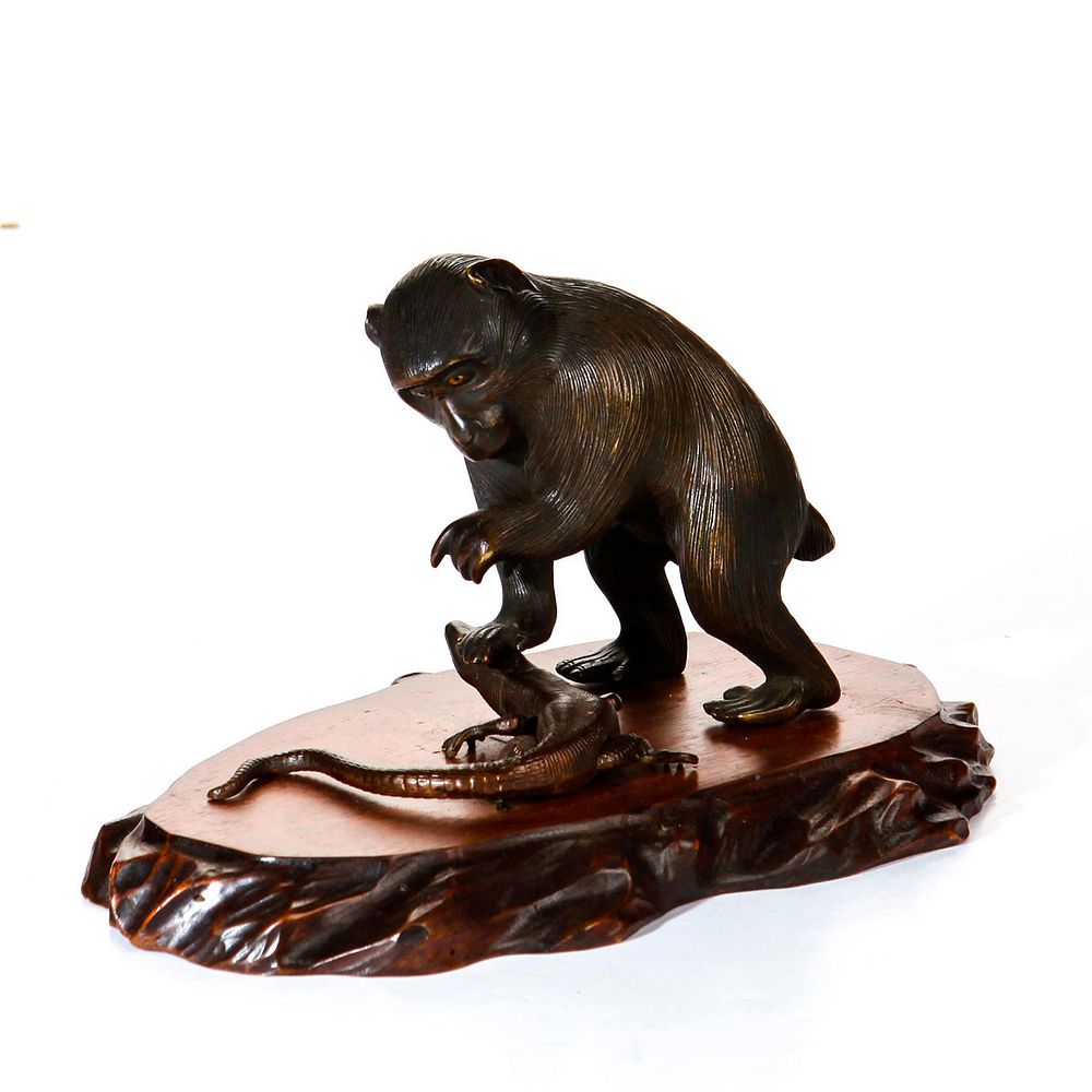 Appraisal: JAPANESE MEIJI PERIOD BRONZE MONKEY ON WOOD BASE Meiji period