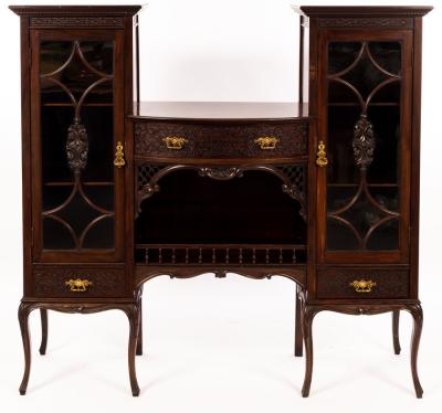 Appraisal: An Edwardian mahogany display cabinet with central bowfront section fitted